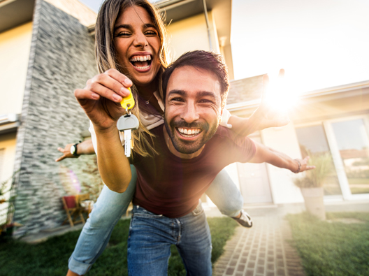 Happy couple holding house key